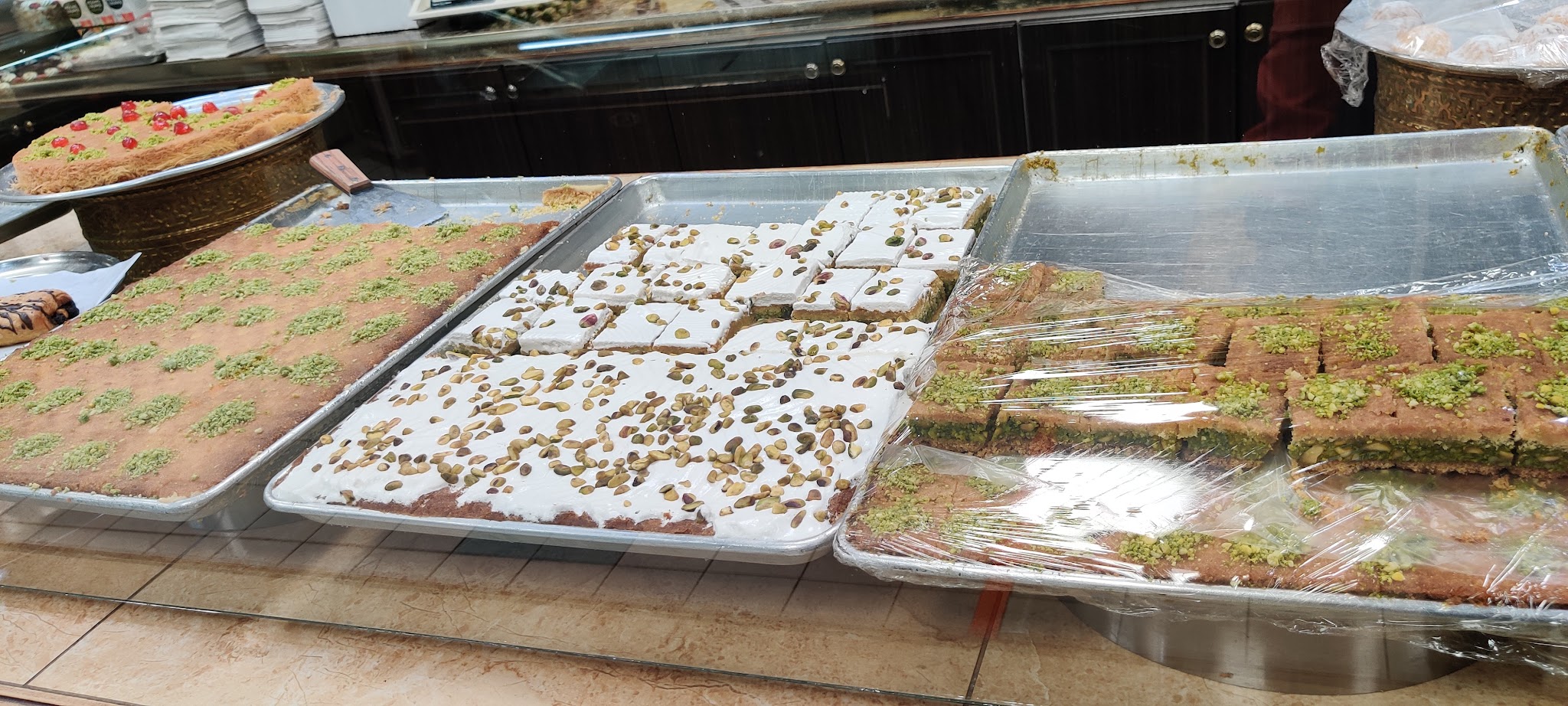 Assorted baklava trays with pistachio and walnut varieties