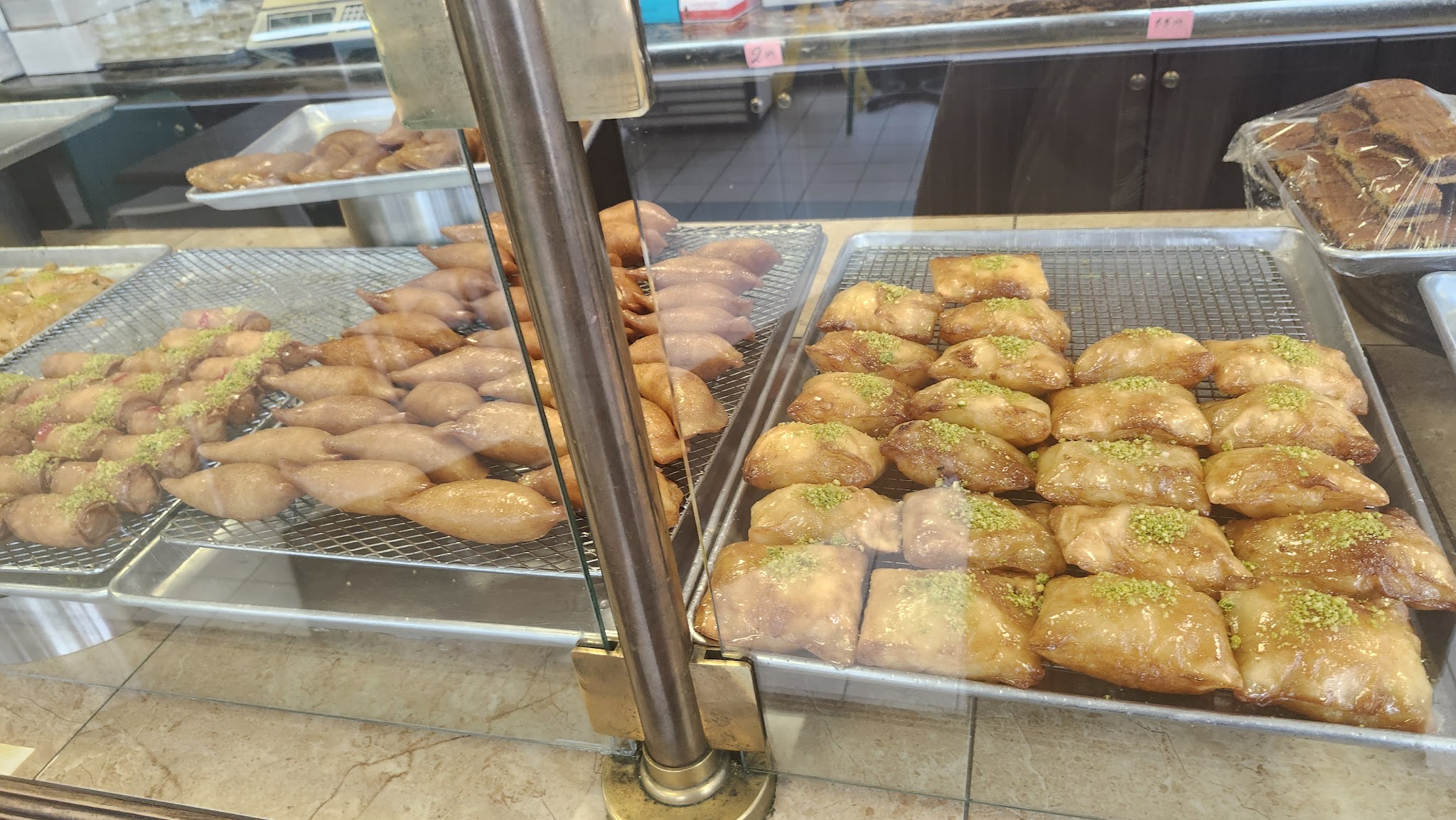 Golden baklava pastries on a cooling rack